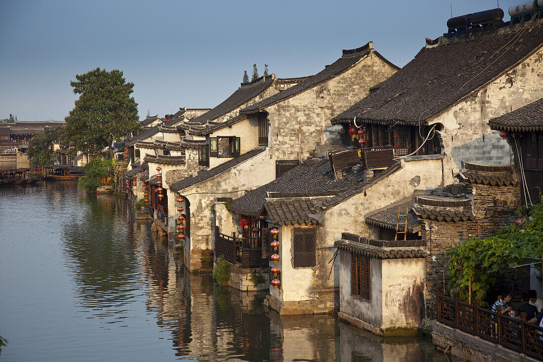 Xitang, Zhejiang Province, China - September 5,  2009: Xitang is a popular tourist town with thousands of years of history and characterized by its traditional architecture, canals and bridges. It is located one hour south of Shanghai.