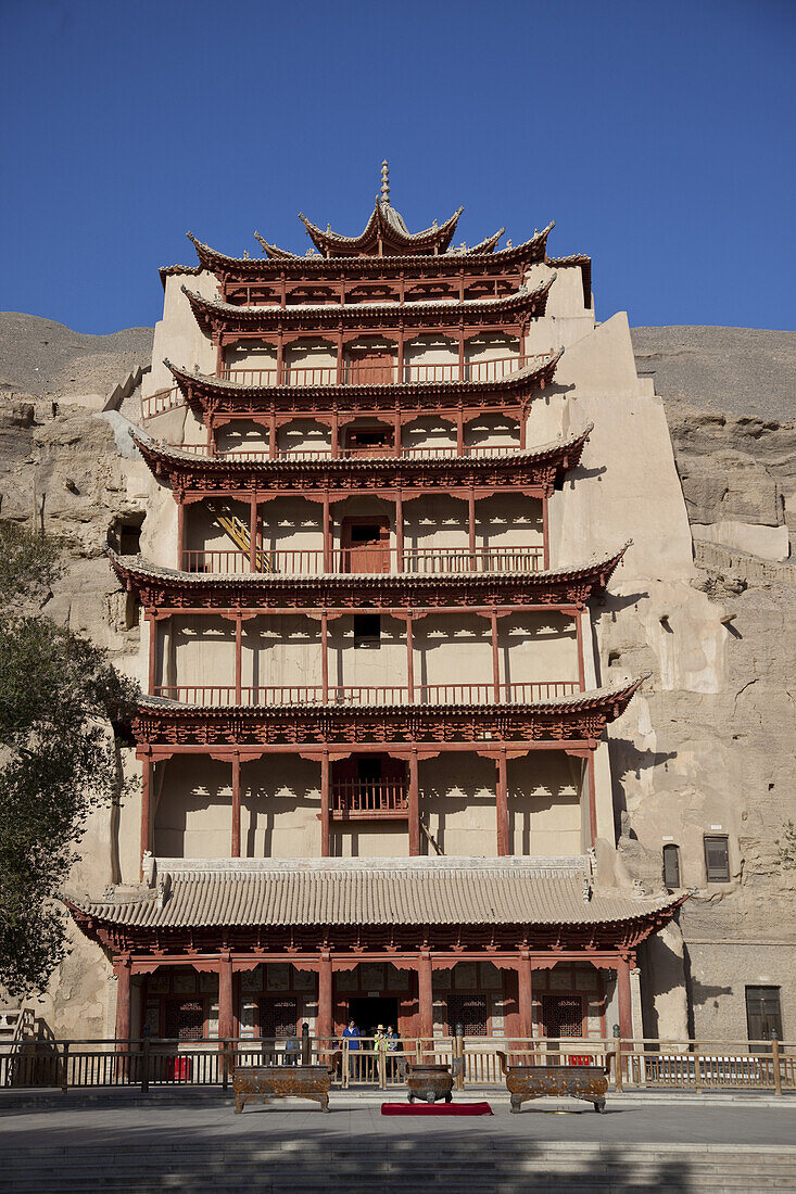 Dunhuang, Gansu Province, China - September 16, 2009:  Mogao Caves in a cliffside outside Dunhuang is home to one of the greatest collections of Buddhist art in the world.