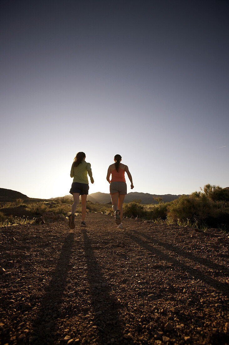 Rachel Elliott and Justine Ritsko running along the Historic Railroad Trail in the Lake Mead National Recreation Area.