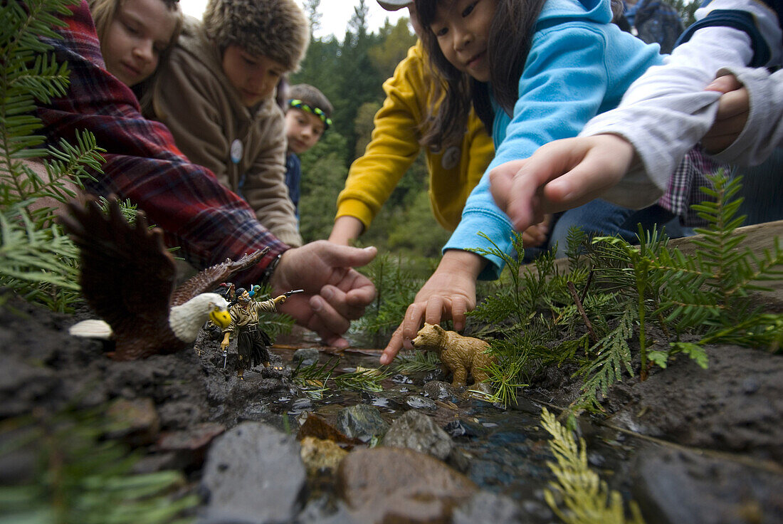 October 12, 2008 The Salmon Festival in Oxbow Regional Park celebrates the annual return of the fall Chinook salmon to the Sandy River. Children learning about the life cycles of salmon with miniature animals and people in a miniature river which is used 