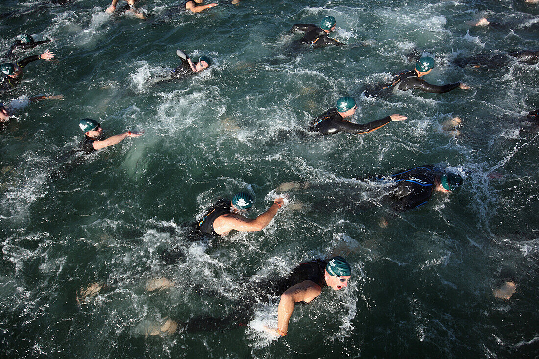 'Competitors start a Swim Leg for the ''Beach to Battleship'' Ironman Triathlon, held in Wrightsville Beach and Wilmington, NC.'