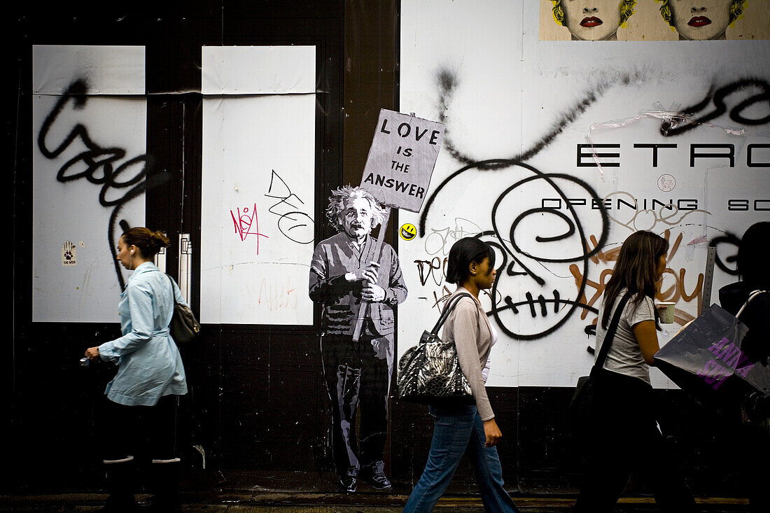 'A street art installation of Albert Einstein holding a sign that reads '' Love is the Answer'' in SoHo area of Manhattan.   New York, NY'