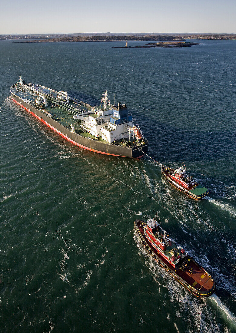 An aerial view of an oil tanker is piloted into Portland Harbor, Maine, February, 2010.