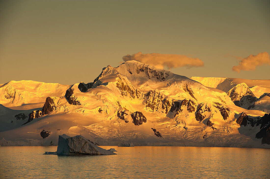 Ice covered mountains at sunset, Lemaire Channel, near Graham Land Antarctica