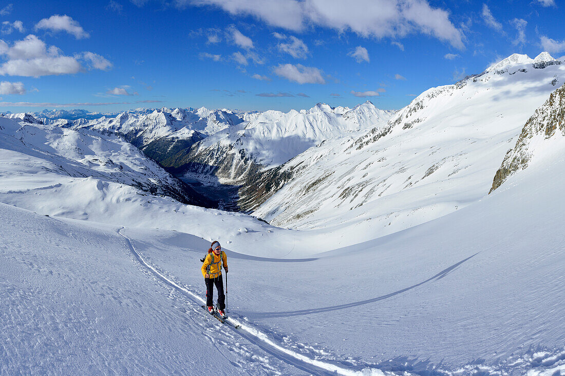 Female back-country skier ascending to Grosser Moeseler, Zillertal Alps, South Tyrol, Italy