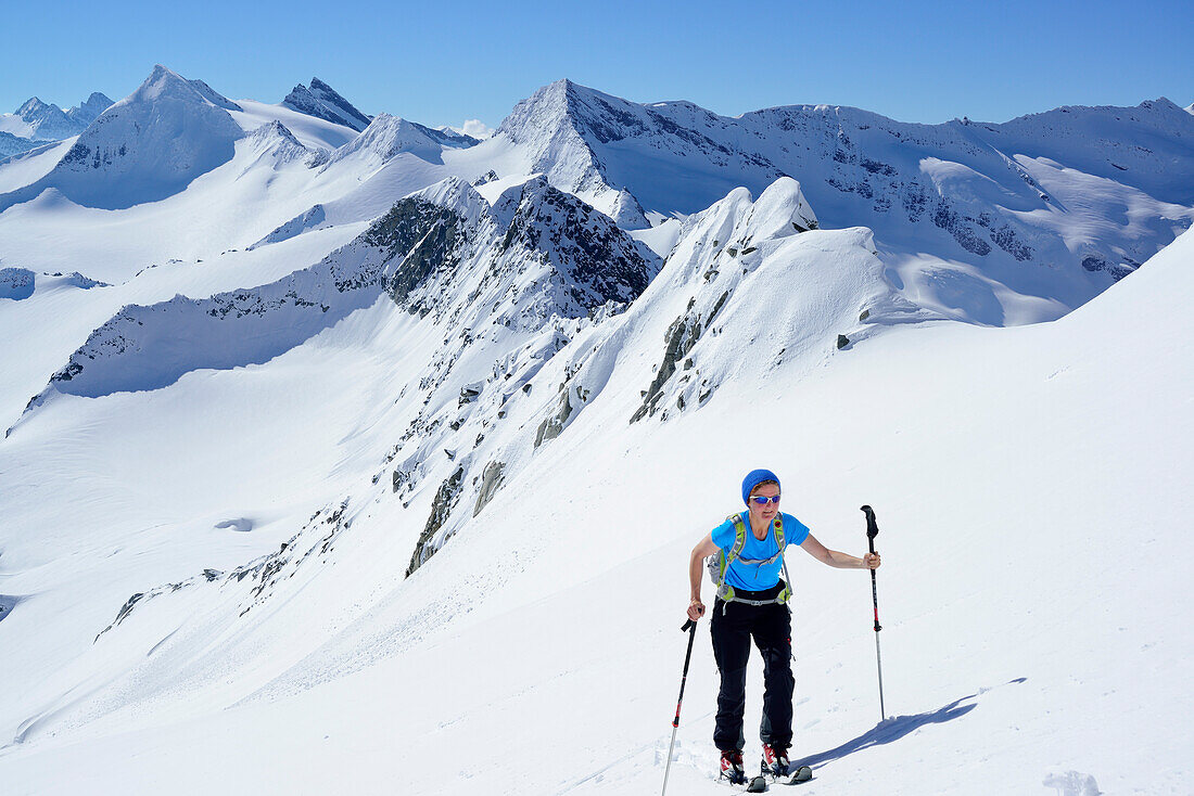 Female back-country skier ascending to Schlieferspitze, Venediger Group, High Tauern National Park, Salzburg, Austria