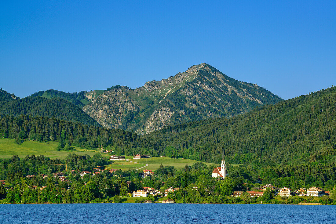 View over lake Tegernsee to Bad Wiessee with Fockenstein in background, Bavarian Alps, Upper Bavaria, Bavaria, Germany