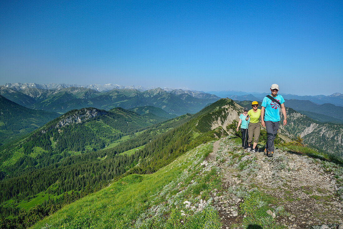 Three hikers ascending to Halserspitz, Blauberge, Bavarian Prealps, Upper Bavaria, Bavaria, Germany