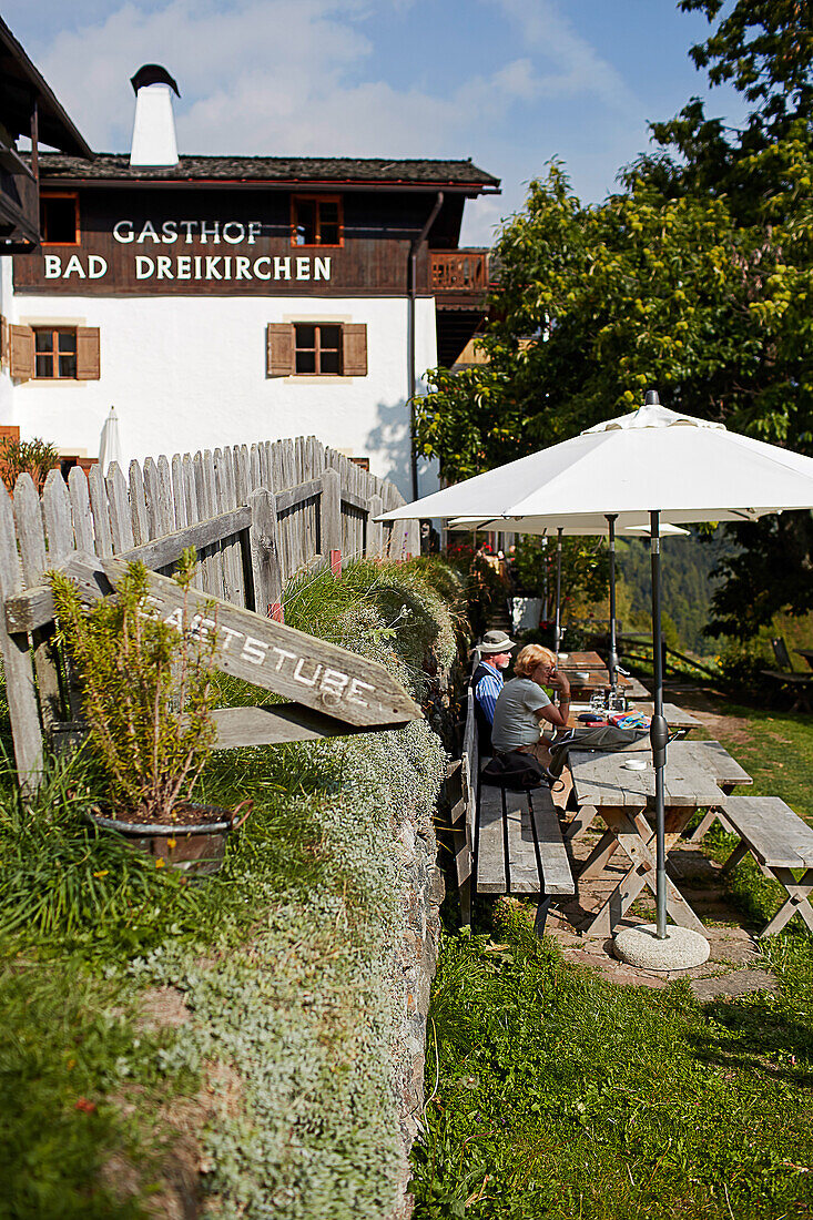 Guests and hikers on the terrace of Hotel Gasthof Bad Dreikirchen, mountain hotel owned by the Wodenegg family, Eisack Valley, Trechiese 12, Barbian, South Tyrol, Italy