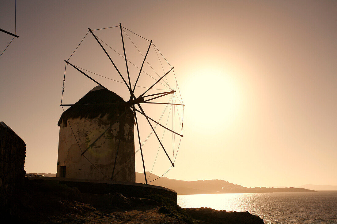 Silhouette of windmill at sunset, Mykonos island, Cyclades Islands, Greece, Europe