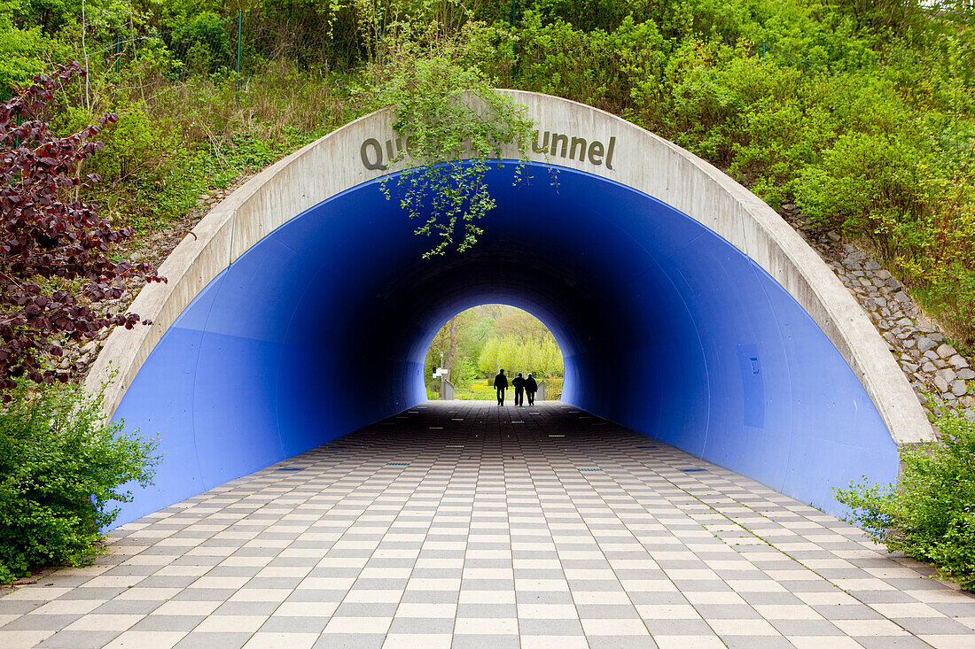 Pedestrians in Quellentunnel tunnel of Landesgartenschau parklands, Bad Wildungen, Hesse, Germany, Europe