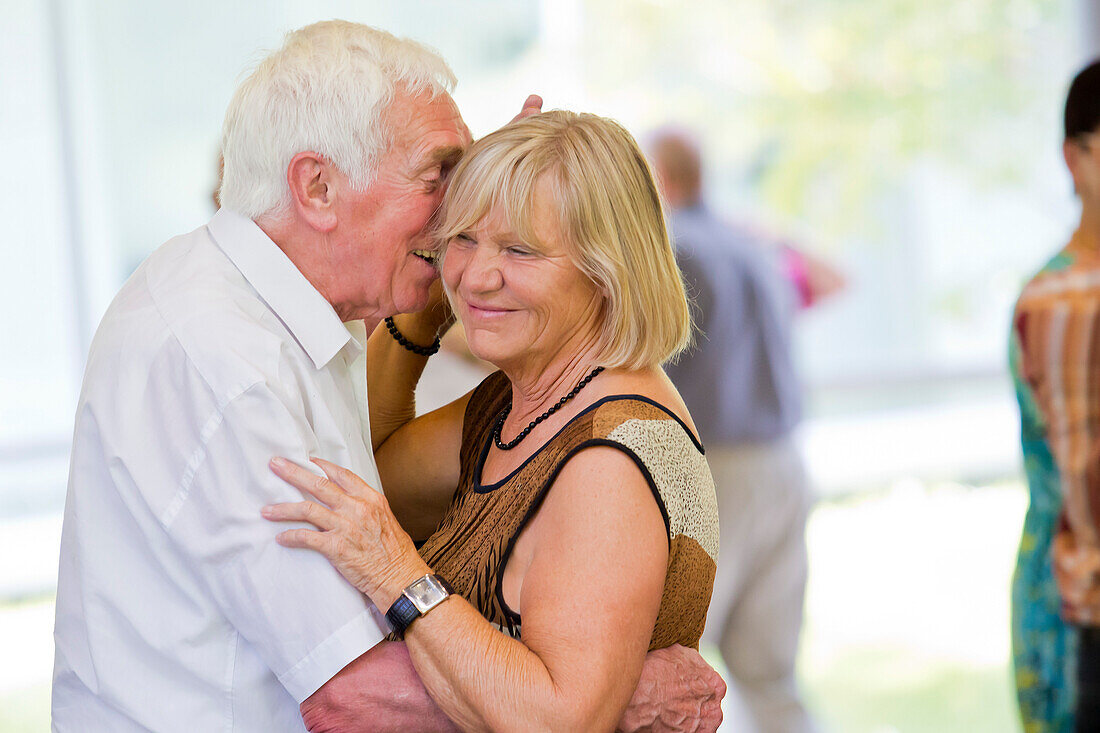 An elderly couple dancing happily together at the afternoon dance in the Wandelhalle Bad Wildungen, Bad Wildungen, Hesse, Germany, Europe