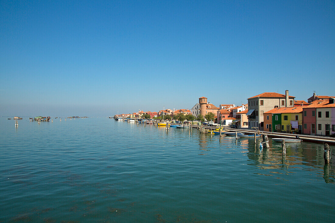 Colourful houses alongside Canale Pellestrina in Venetian Lagoon, Pellestrina, near Venice, Veneto, Italy