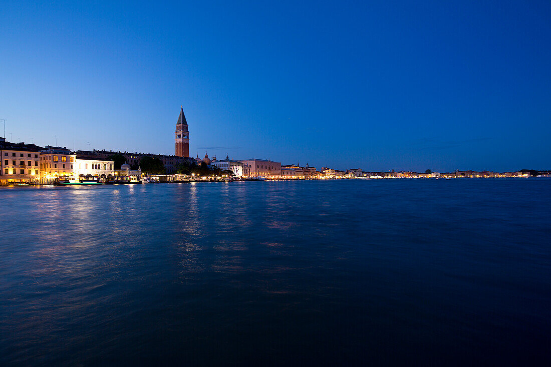 Campanile and Piazza San Marco at night taken from the waterside, Venice, Italy, Europe