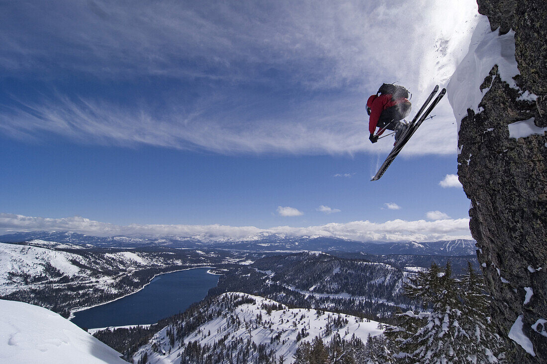 A man skiing off a cliff above Donner Lake California.  Bill Stevenson / Aurora Photos 