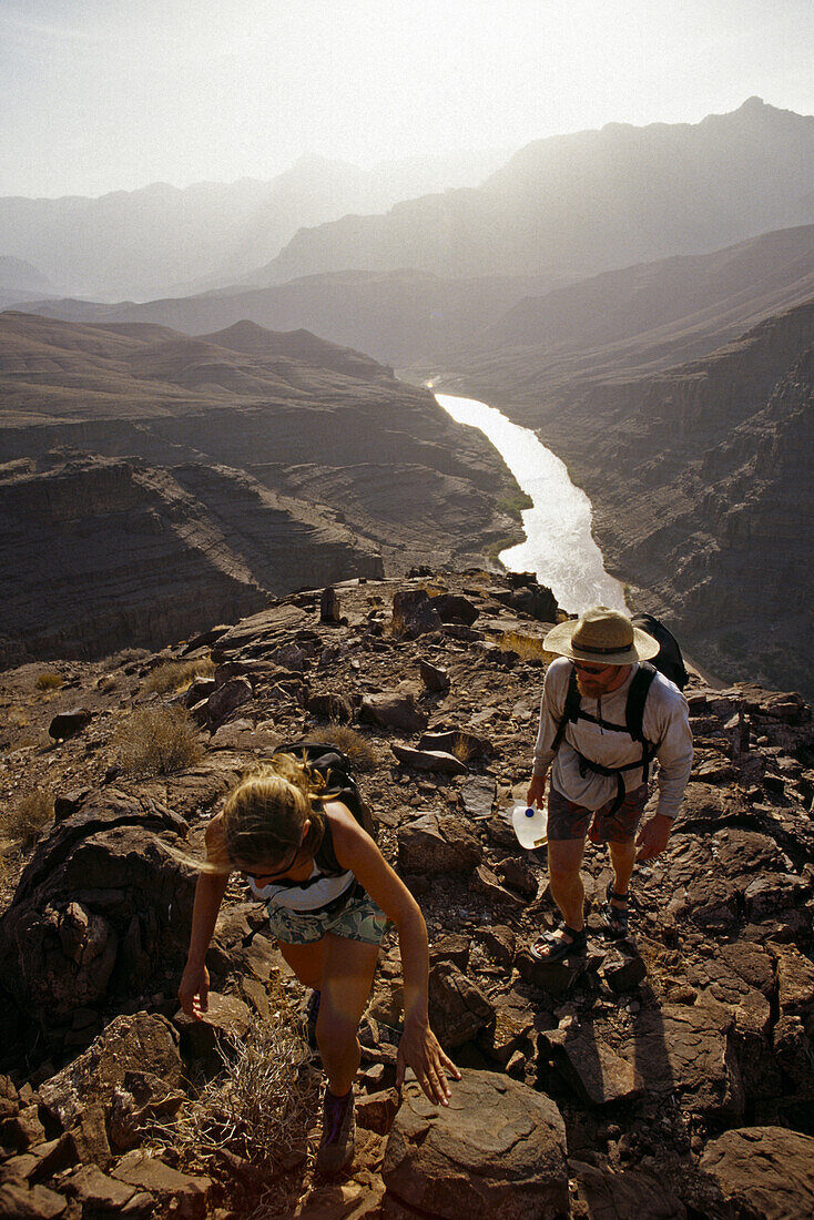 Dave and Angelina Wolf hiking in the Grand Canyon during a river trip, Arizona.  Whit Richardson / Aurora Photos 