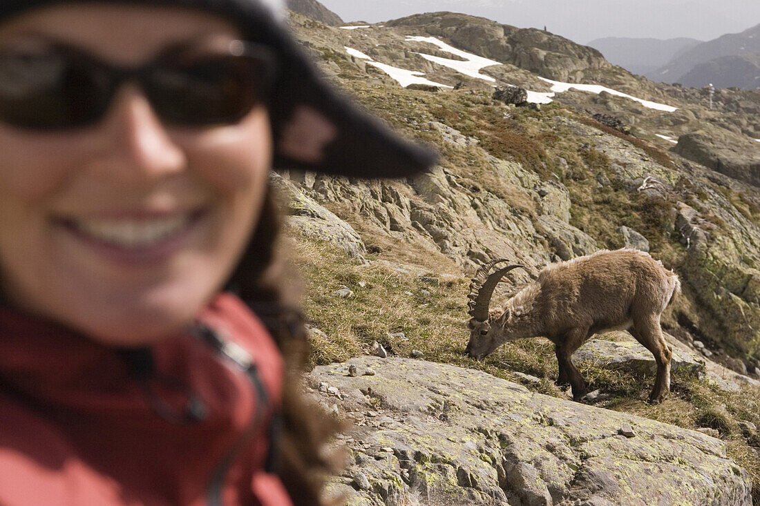 A woman and an ibex near Mont Blanc in the French Alps.