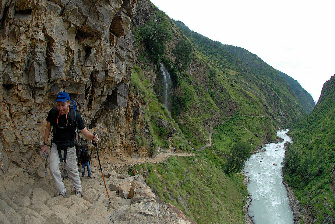 Stuart Sloat ascends a steep trail in the Humla district of remote west Nepal. The mighty Karnali River rushes below.