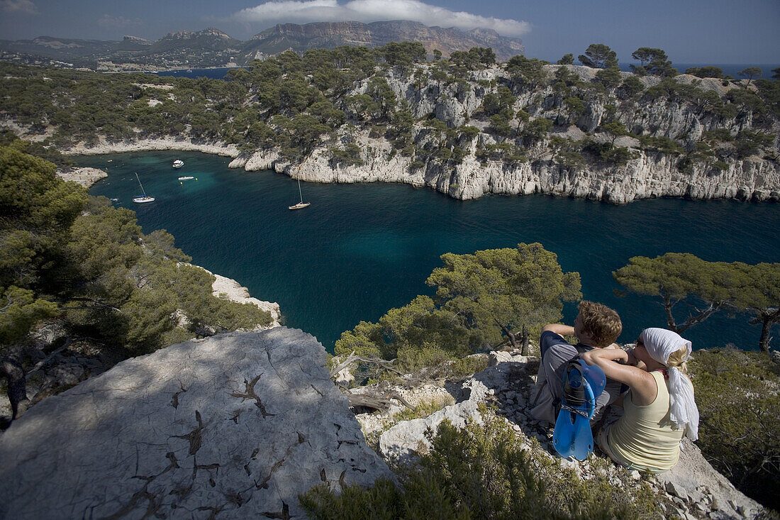 Matt Haine and Kelly Williams stop to take in the view before hiking down to the warm Mediterranean water of Port Miou, the Calanques near the town of Cassis, France. releaecode: ab0173, ab0174