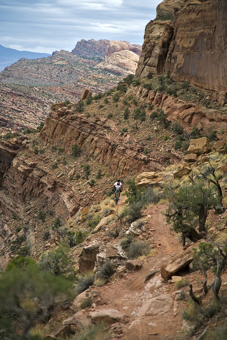 Mark Trevithick mountain biking down the Portal trail, Moab, Utah. The portal trail is know for it's exposure and cliffs. A few mountain bikers have died on this trail falling off the cliff.