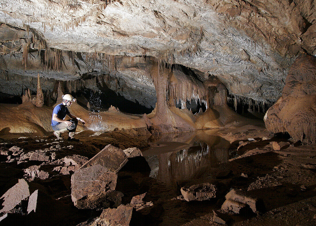 Pool of water fed by a small waterfall in a cave called Whiterock part of the giant Cleawater Cave System, in Mulu National Park