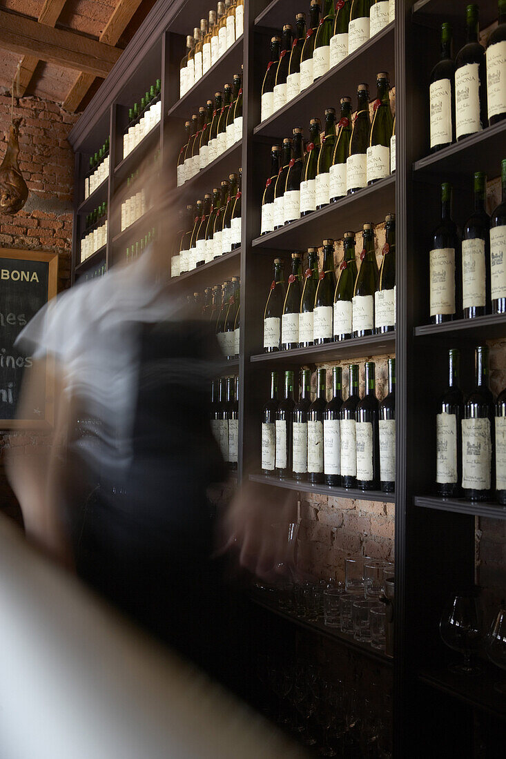 An employee shot at a slow shutter speed to show motion at Narbona winery/restaurant in Carmelo, Uruguay.  releasecode: THS_0001