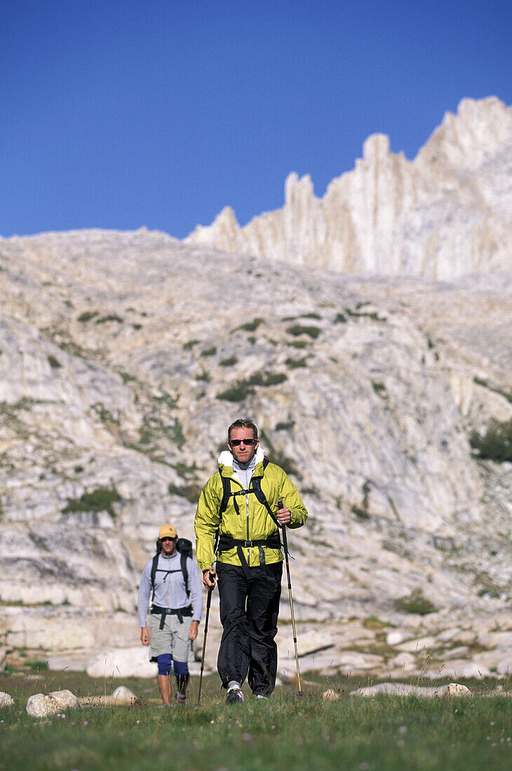 Dan Duane leads the way through an alpine meadow while backpacking with Tom Purcell on the Sierra High Route, a 195 mile trackless path almost entirely between 9,000 and 11,500 feet in elevation in the Eastern Sierra Nevada mountains in California.