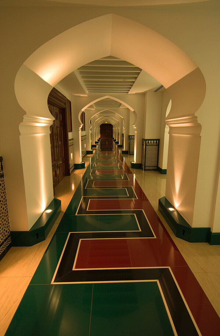 A classic arch frames a hallway, in the luxurious of the Burj al Arab Arabian Tower, the world's tallest  hotel at 321 meters, on the beach along the Persian Gulf, Dubai, United Arab Emirates.  A super luxury hotel, the Burj al Arab and its unique archite