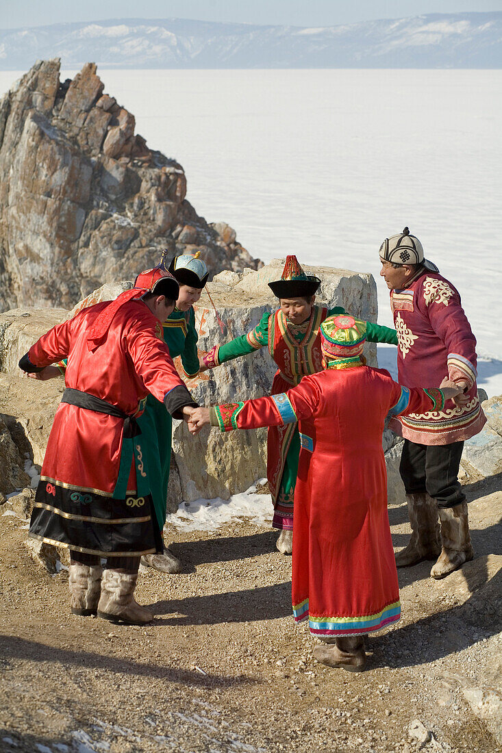 OLKHON ISLAND, SIBERIA, RUSSIA- MARCH 13, 2007: A couple and their parents performing a song and dance in a local traditional Buryat wedding ceremony on Olkhon Island, Siberia, Russia on March 13, 2007.