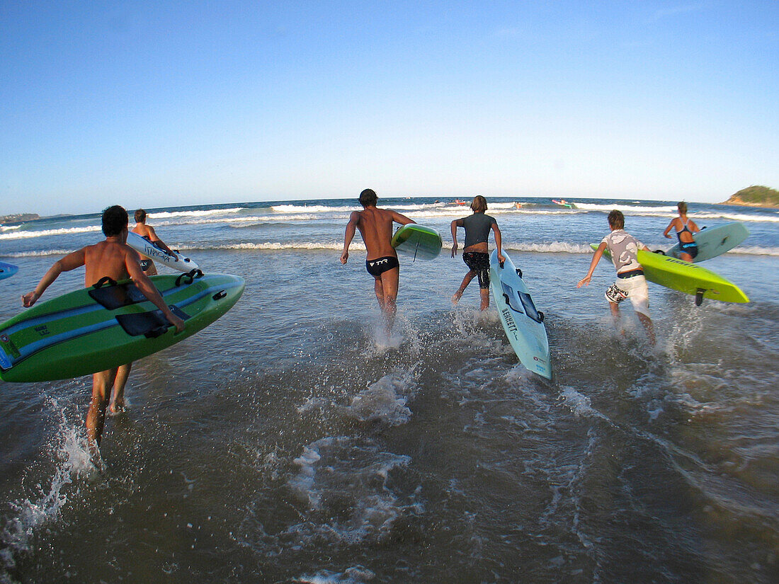 Teenager from the Manly Surf Club doing a paddle board training before a surf carnival.