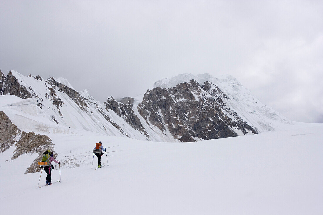 Two women skiing on the Biafo glacier in the Karakoram himalaya in Pakistanbs1131, bs1132