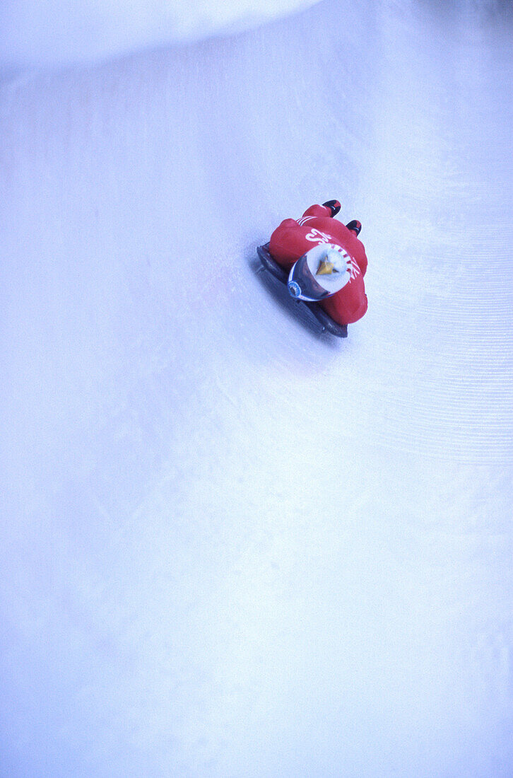 Skeleton racer flying down the bobsled track in Salt Lake City, Utah.