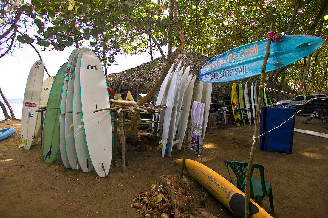 Dominican Republic - Thatched roof surfboard and Windsurfer rental shop at Encuentro surf spot near Cabarete.