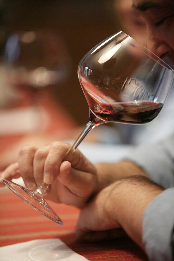 Tasting red wine in Monforte d'Alba, Piedmont, Italy.