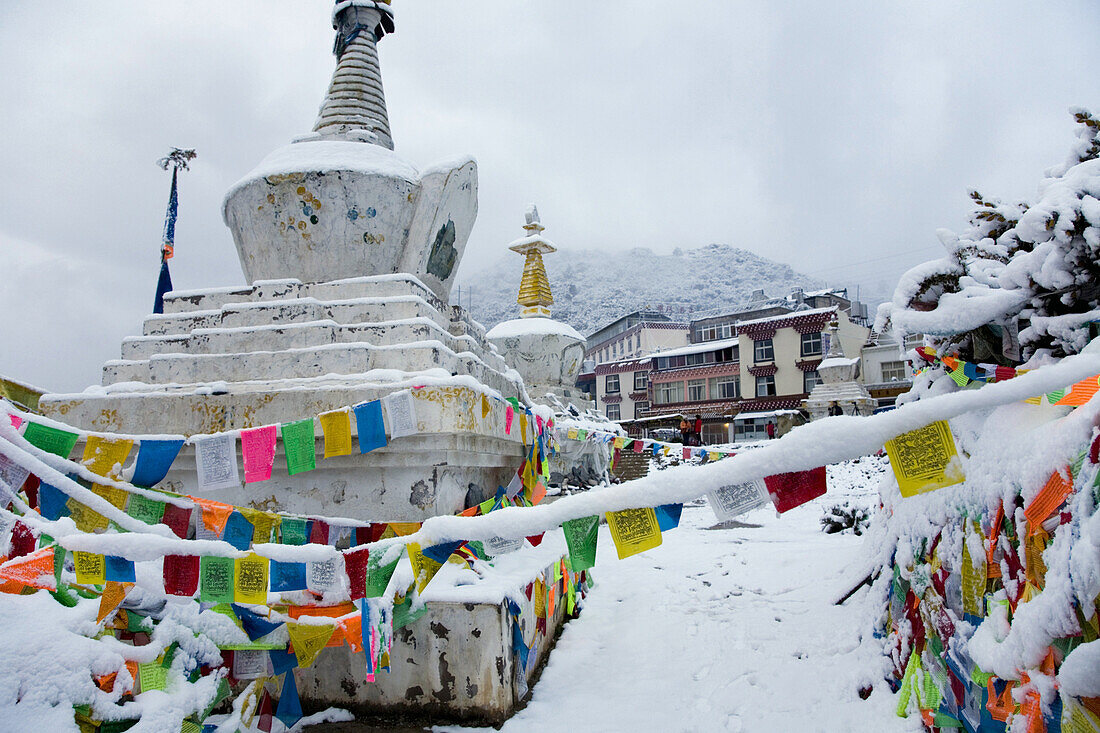 Stupas in fresh snow at the vista point village of Feilaisa, Yunnan Province, China.