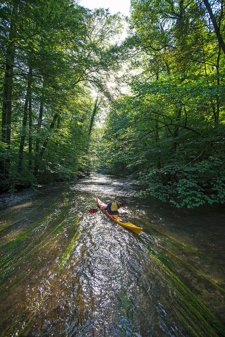 Exploring the river Wuerm in a kayak, near Munich, Bavaria, Germany