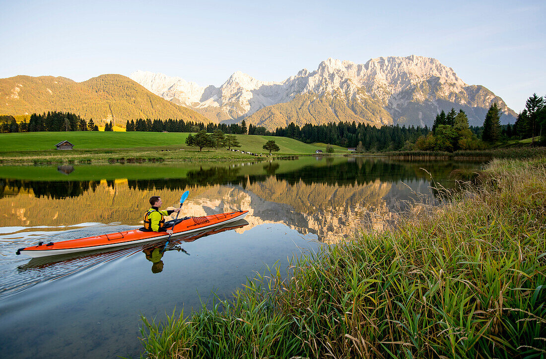 Paddler on the Schmalensee in front of the Karwendel range, Mittenwald, Germany