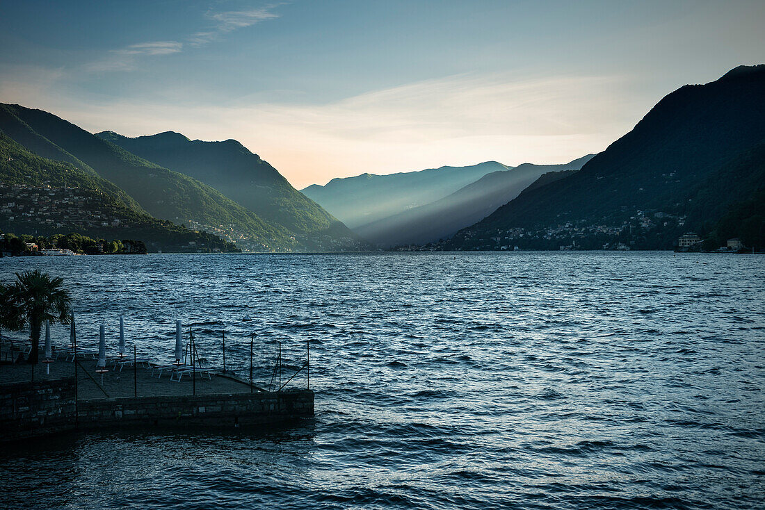 First light hitting the surrounding mountains of Lake Como, Menaggio, Lombardy, Italy, Europe