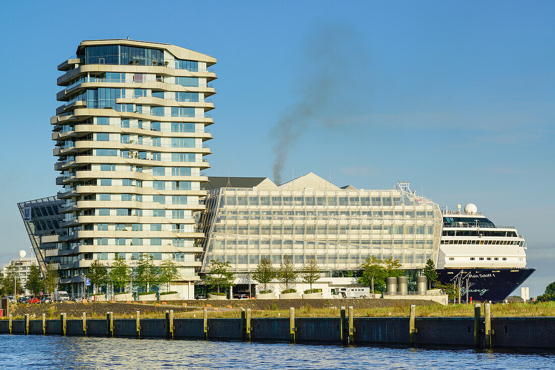 Marco Polo Tower with Grasbrookhafen, huge passenger liner in the background, Hafencity, Hamburg, Germany