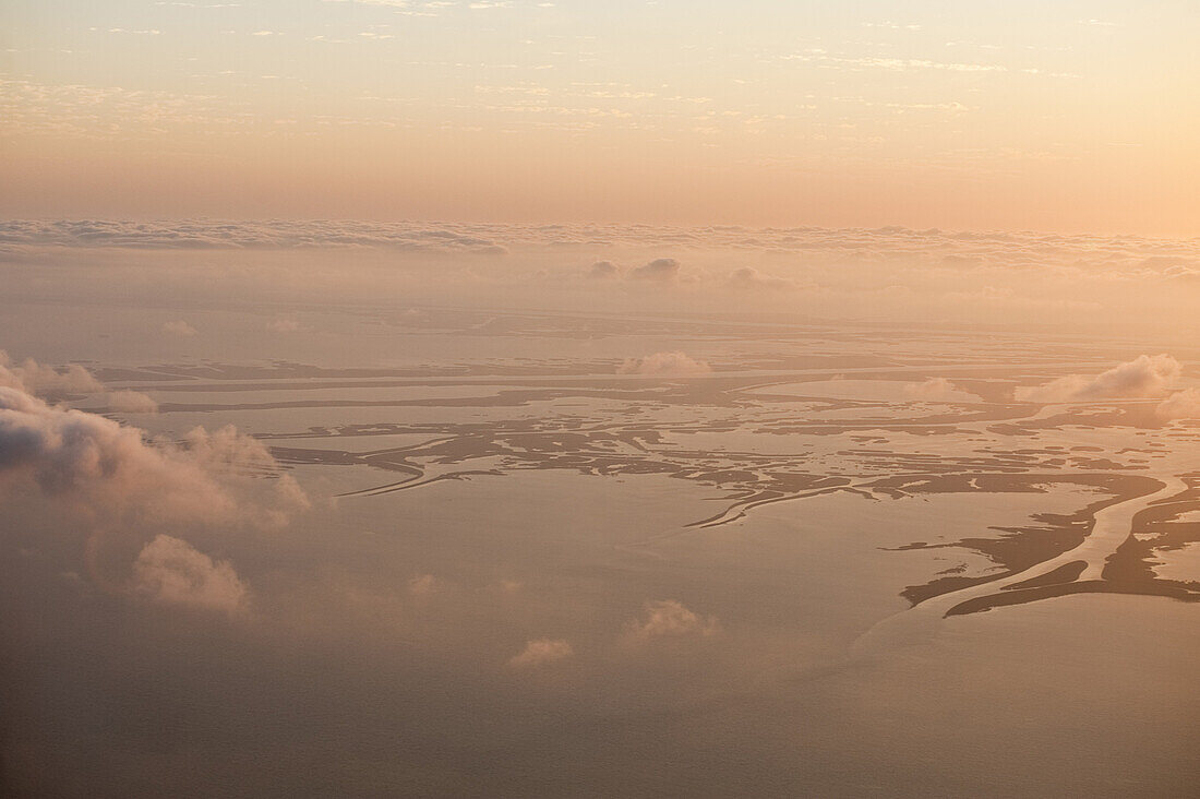 Mississippi Delta, LA - May 7, 2010, Sunset over the Mississippi Delta. The Mississippi Rivers drains nearly half of the United States and deposits sediment into a complex marshland in the Gulf of Mexico. .