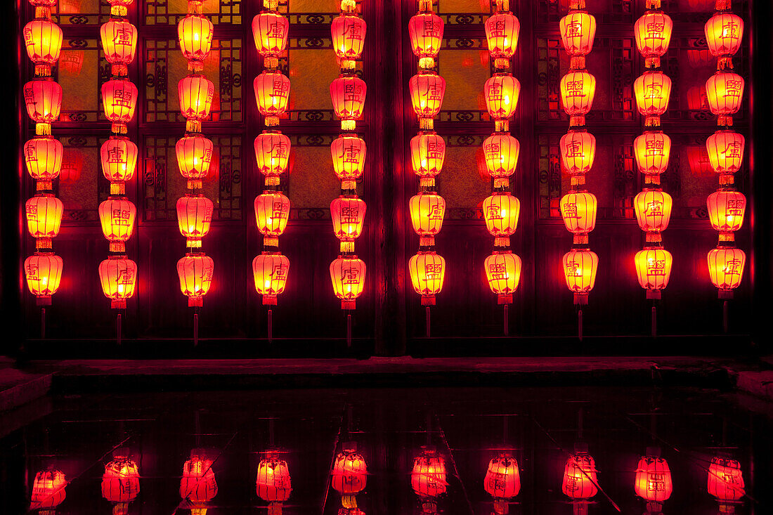 Lamps adorn a wall at an historic residence of a salt merchant now open to the public in Yangzhou, China, a suburb city of Shanghai and major producer of photovoltaic cells for solar power.