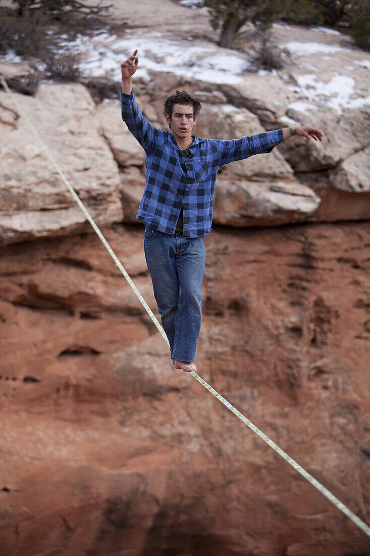 Jan Galek walks a highline with no safety leash at the 2010 Thanksgiving Moab Highlining Rendezvous for Extreme Slackliners