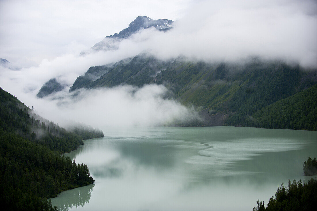 A storm clears over glacial Lake Kucherla in Mt. Belukha Nature Park, Siberia. The lake is a popular camping spot for Russian backpackers.