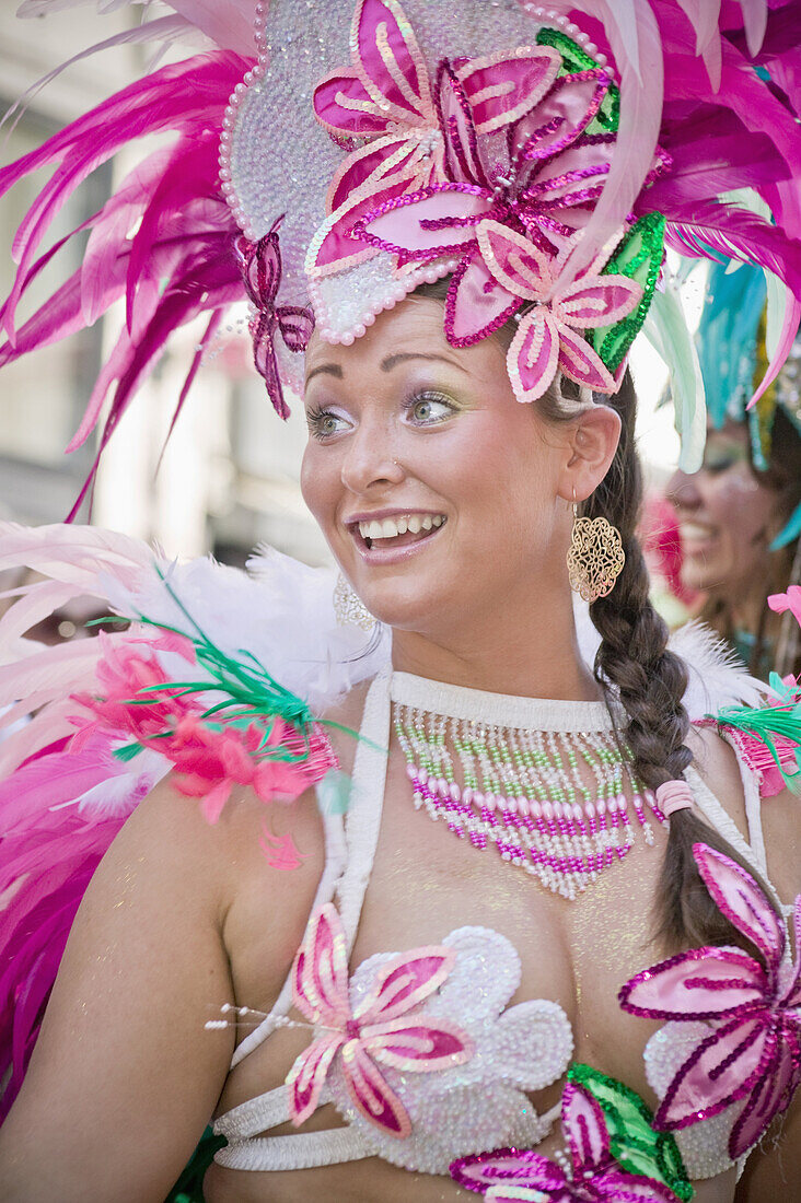 A dancer takes part in the parade during the Copenhagen latin carnival in Denmark. The Whitsun Carnival of Copenhagen is a very popular annual festival, drawing over 100,000 spectators a year. The highlight of the carnival are the two parades, but also no