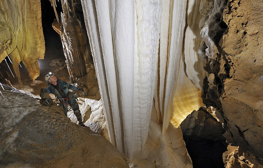 A British cave explorer admires this truly awe-inspiring crystal formation known as 'Blanc de Blanc' Whiter than White in French,. It is the jewell of this particular cave called The Felix Trombe, in the Pyrenees, France.