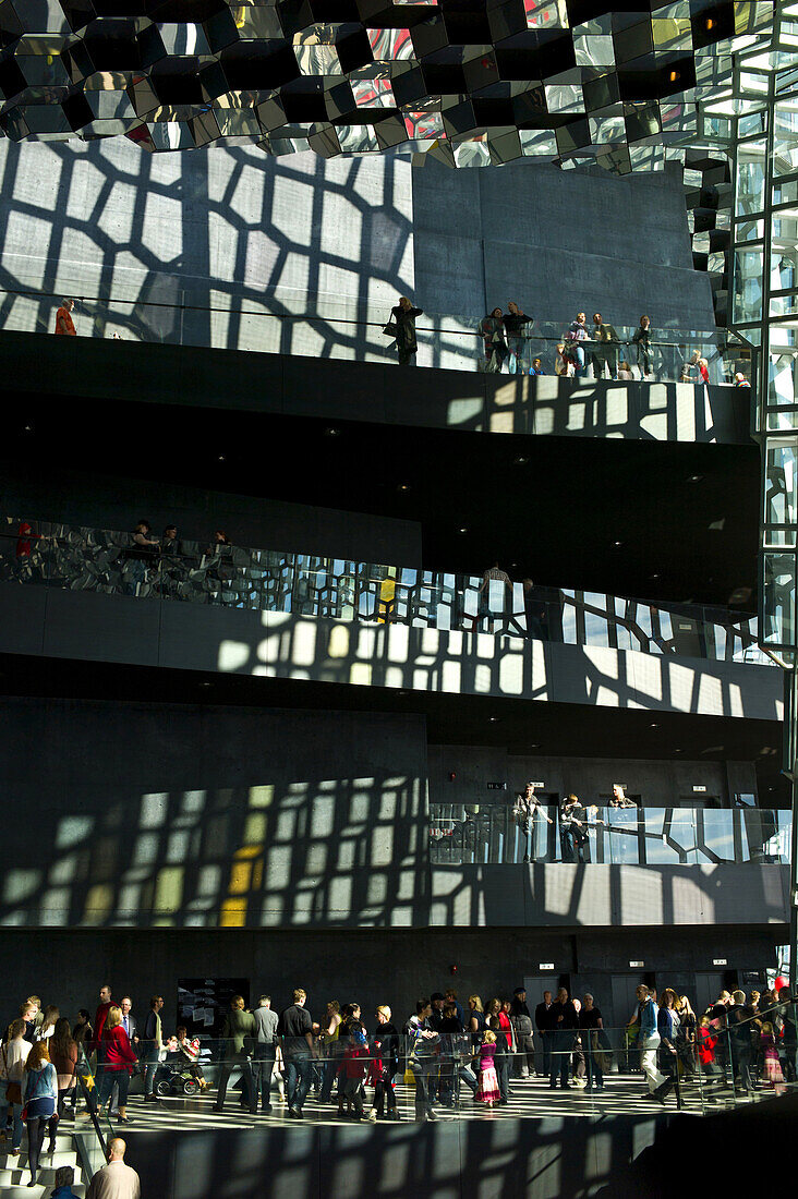 'View of people from lobby on various levels touring Harpa ''The Harp'' concert hall in Reykjavik, Iceland.'