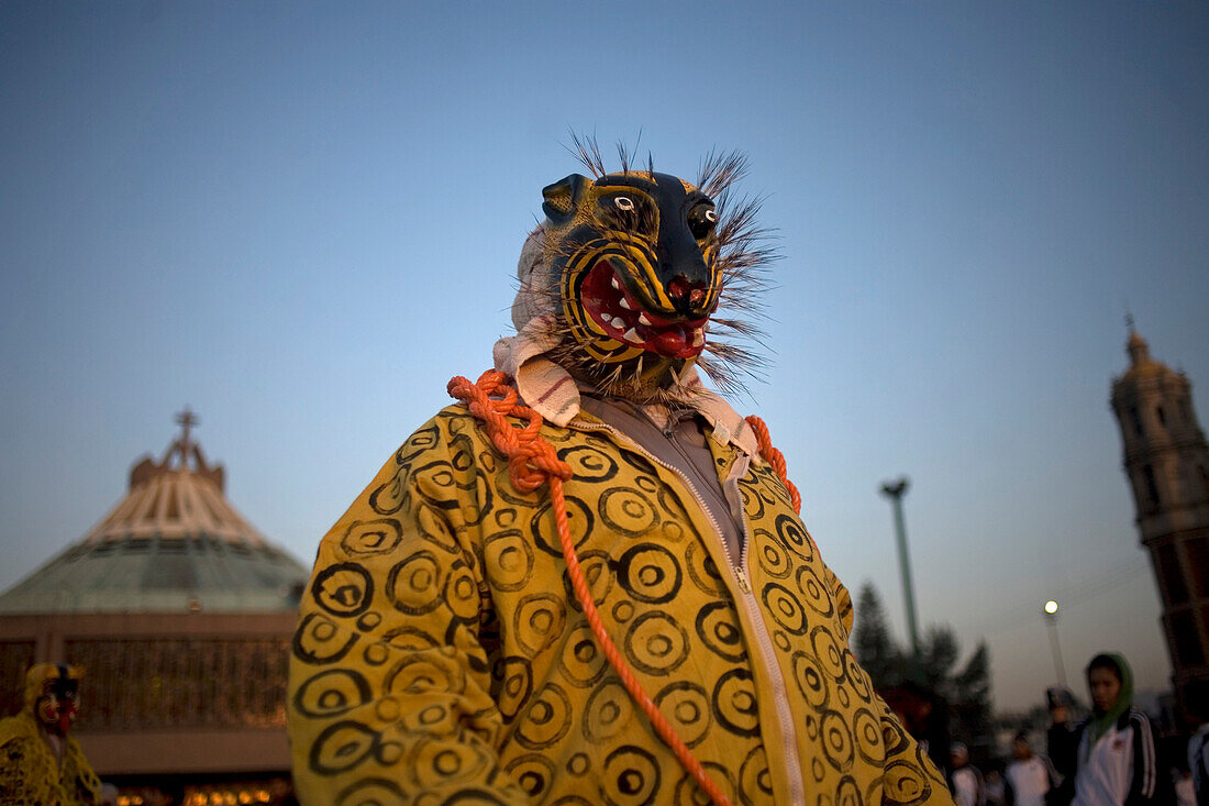 Dancers from Olinala,  Guerrero state,  perform the Danza de los Tecuanes Jaguars Dance, outside the Our Lady of Guadalupe Basilica in Mexico City,  December 9,  2011. Hundreds of thousands of Mexican pilgrims converged on the Basilica,  bringing images
