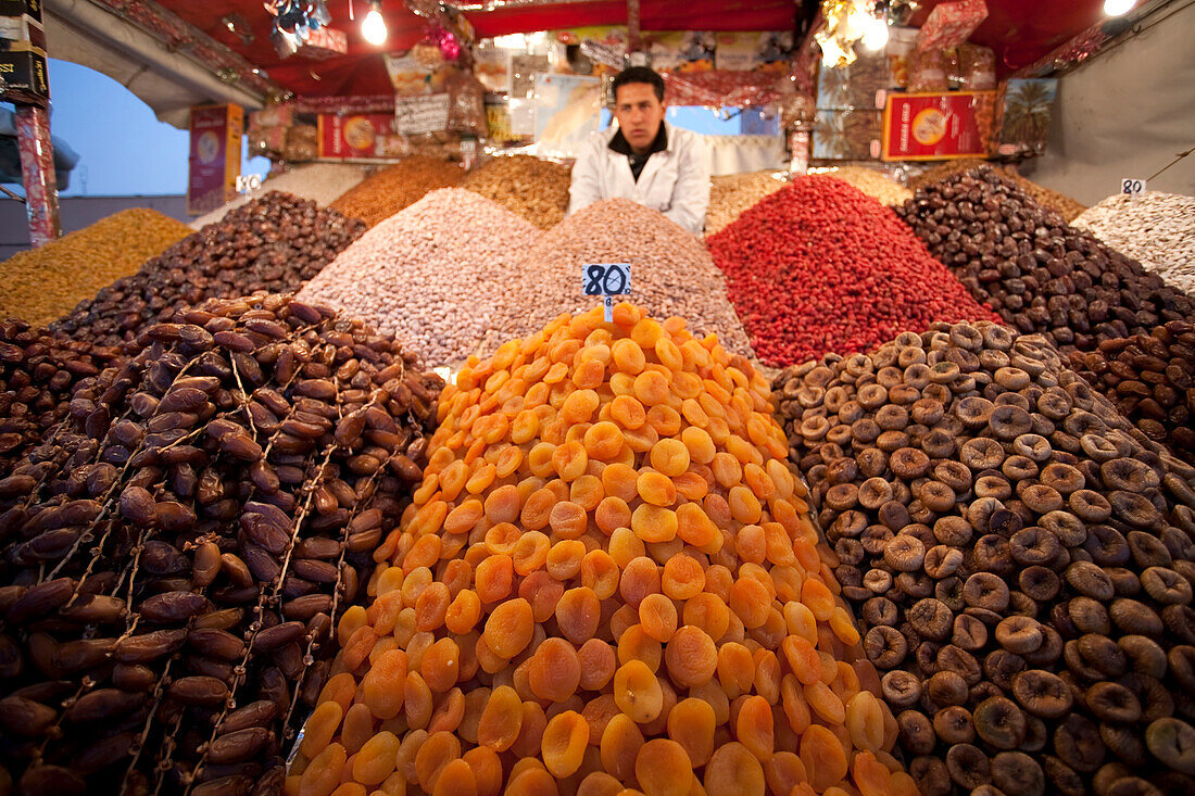 Dates, peaches, and nuts are sold by a street vendor in Marrakesh, Morocco.