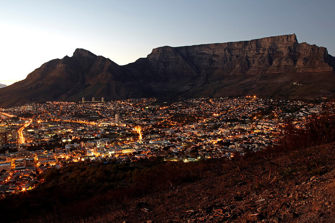 A view of Cape Town and Table Mountain from Signal Hill just before sunrise. South Africa.