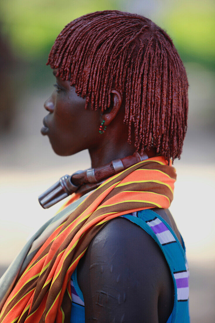 Hamar women roll their locks with fat and red ochre assile, and than twist them into crimson-colored dreads called Goscha, a style that men find attractive.  Dimeka, Ethiopia, 2010